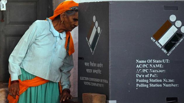 An elderly woman looks at the voting machine after casting her vote at Badshahpur village in Gurugram, Haryana. Opinion surveys have predicted a BJP romp in Haryana too, where its main opposition, the Congress party, could face a near decimation. Congress, however, is hoping to recover from its national election rout last spring and make a comeback in the state. (R Raveendran / ANI)
