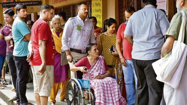 A senior citizen on wheelchair cast vote during Maharashtra assembly election at Municipal School,Kandivali in Mumbai, on Monday, October 21, 2019.(Pramod Thakur/ HT) A senior citizen on wheelchair cast vote during Maharashtra assembly election at Municipal School,Kandivali in Mumbai, on Monday, October 21, 2019.(Pramod Thakur/ HT)