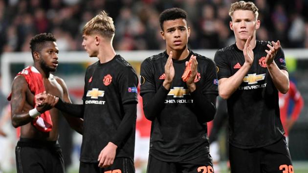 Manchester United's Mason Greenwood and Manchester United's Scott McTominay applaud the fans. (REUTERS) Manchester United's Mason Greenwood and Manchester United's Scott McTominay applaud the fans. (REUTERS)