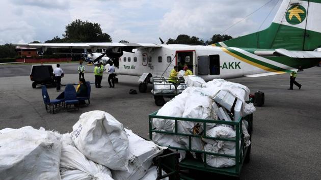 Nepali airline staff unload waste collected from the Everest region, at Tribhuvan airport in Kathmandu. “Waste doesn’t need to be wasted,” Nabin Bikash Maharjan of local recycling organisation Blue Waste to Value (BW2V) told AFP. (Prakash Mathema / AFP)