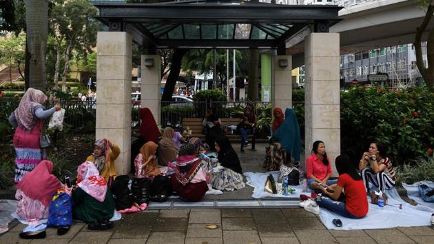 Migrant workers gathered near Victoria Park. Lawyers for Indah say they plan to launch a private prosecution after police refused to identify the officer that fired the shot. “What the Indonesian government is doing now is not enough,” a domestic helper at the protest who have her name Sringatin told AFP. “Just asking our community to pray and stay calm is not enough.” (Mohd Rasfan / AFP)