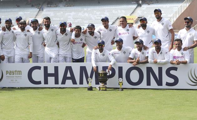 Members of Indian team pose with the winners trophy after their win. (AP)