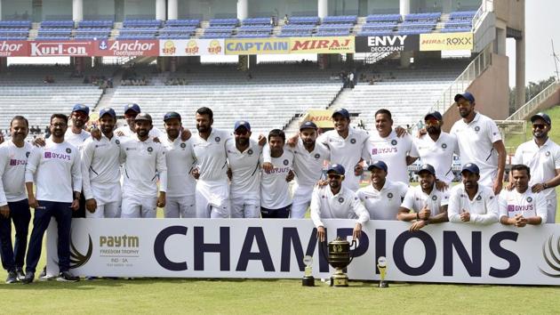 Indian captain Virat Kohli and team players pose with the trophy. (PTI)