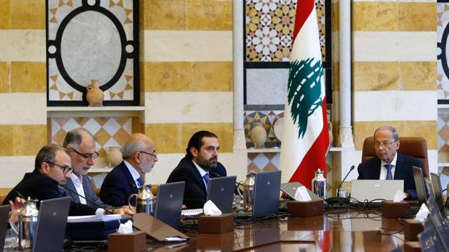 Lebanon's President Michel Aoun (R) presides a cabinet session at the Baabda palace. Hariri said that the Cabinet approved the 2020 budget with a deficit of 0.63% with no new taxes. The reforms include of the salaries of ministers and lawmakers, overhauling the electricity sector, working to scrapping the ministry of information and other public institutions and downsizing others. (Mohamed Azakir / REUTERS)