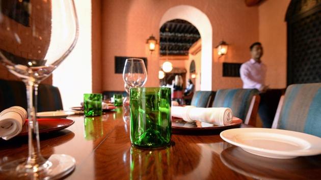 A cup (C) cut from glass collected as waste on Mount Everest, is seen at a restaurant in Kathmandu. Aanchal Malla of Hotel Yak & Yeti, a luxury five-star hotel in Kathmandu, said opting for the upcycled goods was in-line with the hotel’s move towards sustainable and environmentally friendly products. (Prakash Mathema / AFP)