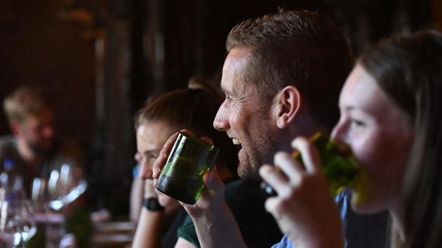 Customers use cups cut from glass collected as waste on Mount Everest, at a restaurant in Kathmandu. “It is not just better for us and the environment but then it goes way bigger than that... it is encouragement of everyone who is trying to move into that direction of making the globe into a better place, reducing all the waste,” Malla said. (Prakash Mathema / AFP)