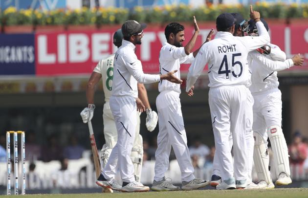 India's Shabaz Nadeem, center without cap, celebrates with teammates. (AP)