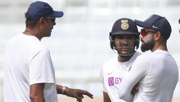 File image: India captain Virat Kohli, right, and teammate Rohit Sharma, center, listen to team coach Ravi Shastri. (AP) File image: India captain Virat Kohli, right, and teammate Rohit Sharma, center, listen to team coach Ravi Shastri. (AP)