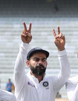 India's captain Virat Kohli flashes victory sign during presentation ceremony. (AP)