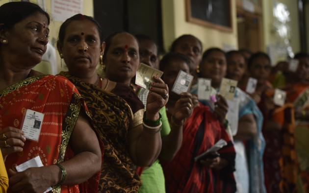 Female voter stand in queue to cast their vote, during the state election at Colaba in Mumbai on Monday. (Photo by Anshuman Poyrekar/ Hindustan Times) Female voter stand in queue to cast their vote, during the state election at Colaba in Mumbai on Monday. (Photo by Anshuman Poyrekar/ Hindustan Times)