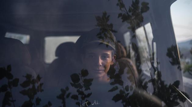 13-year-old Eriko sits in the driver's seat of a car in Kute. There are some signs in the favour of the residents. In August, the government announced it was cancelling a project in central Albania’s Holta Canyon, and would tear down part of a dam that’s already built. The Infrastructure and Energy Ministry said in a statement the decision came after discussions with residents and an environmental review. (Felipe Dana / AP)