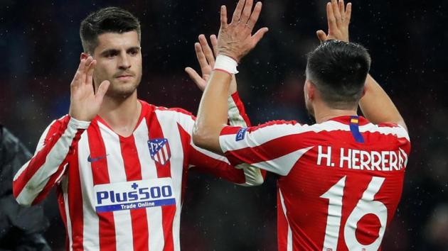 Atletico Madrid's Alvaro Morata and Hector Herrera celebrate after the match(REUTERS)