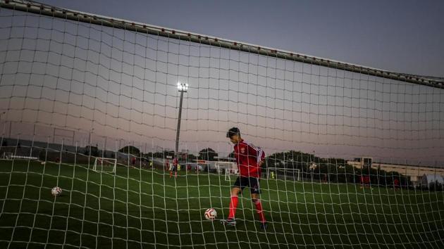 A Benfica’s under 15 player attends a training session at Benfica's Football Academy in Seixal, Portugal. Benfica, who hosted Lyon on Wednesday in the group stage of the Champions League, are reaping the rewards from the club’s academy base opened in 2006 in Seixal, a working class suburb on the south coast of the Tagus estuary. (Patricia De Melo Moreira / AFP)