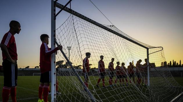 Benfica's under 15 players attend a training session. During Lage’s absence, the president of Benfica, Luis Filipe Vieira, hired Rui Vitoria, who signed up to the mantra of trusting and giving opportunities to youngsters but was sacked following a run of poor results. Before Vitoria, the strategy under his predecessor Jorge Jesus had been to unearth rough diamonds in South America, with the intention of adaptation to European football. (Patricia De Melo Moreira / AFP)