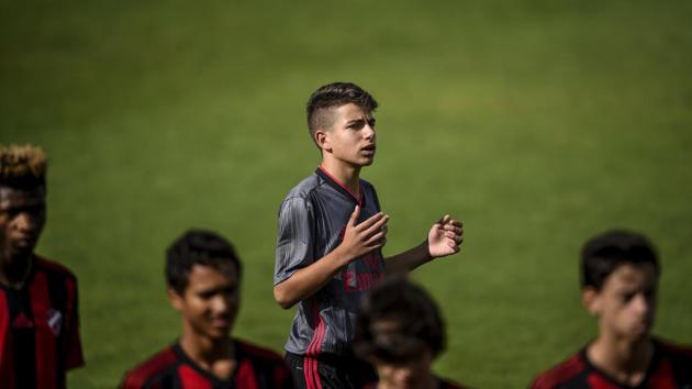 Benfica’s midfielder Pedro Pato (C) moments before the match against Sacavenense. Among the 88 players aged 11 to 18 who live here is Pato, who is part of the under-15 team. Pato, 14, came to Seixal three years ago and says he finds the regime “much tougher” than at the club he left in Vila Franca de Xira, a town in the northern suburbs of Lisbon. (Patricia De Melo Moreira / AFP)