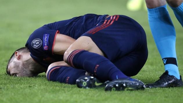 Bayern's Lucas Hernandez lies on the ground.(AP)