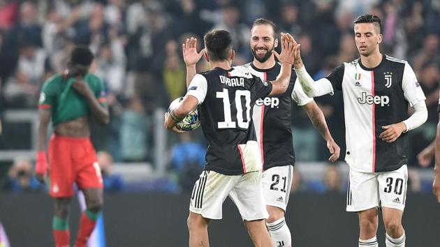 Juventus' Paulo Dybala, left, celebrates with his teammates(AP)