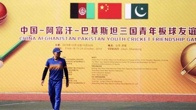 A cricketer walks by a poster of the three-nation event.(HT Photo) A cricketer walks by a poster of the three-nation event.(HT Photo)