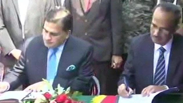 SCL Das, joint secretary (internal security) in the home ministry, and the Pakistani side by Mohammad Faisal, director general (South Asia) in the Foreign Office sign the agreement.(Photo: ANI)