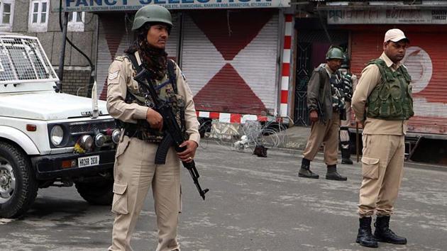 CRPF personnel stand guard at a market in Srinagar. Polling will begin in the morning and conclude at 1 pm. (ANI Photo/ Representative image)