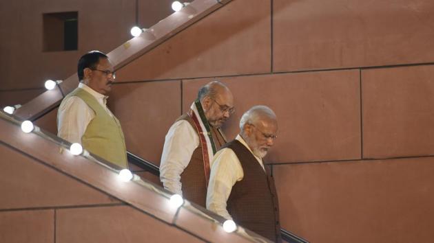 Prime Minister Narendra Modi, Home minister Amit Shah and BJP working president JP Nadda arrives to address their supporters after Haryana and Maharashtra election results were declared, at party headquarters, in New Delhi.(Burhaan Kinu/HT PHOTO)