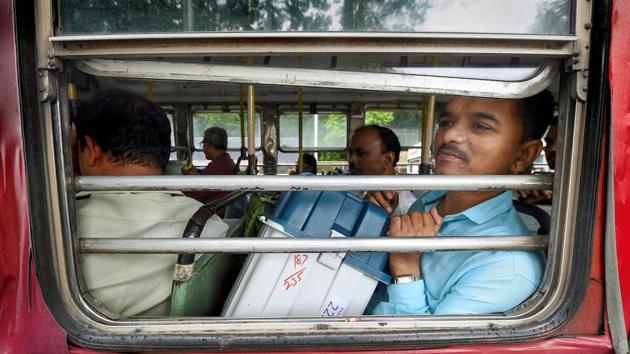 Poll officials, with EVMs and other material, leave for their respective polling stations, a day ahead of Maharashtra Assembly polls, in Mumbai on Sunday.(Photo: PTI)