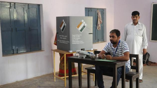 A voter casts her vote during Haryana Assembly elections, at Basai village, in Gurugram. (Photo by Parveen Kumar/ Hindustan Times) A voter casts her vote during Haryana Assembly elections, at Basai village, in Gurugram. (Photo by Parveen Kumar/ Hindustan Times)