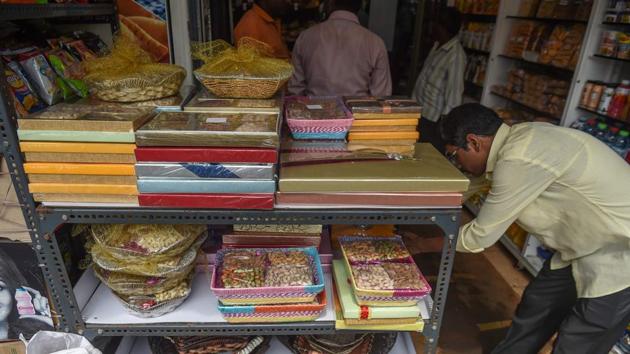 Gift boxes arranged at a store in Mumbai. The owner of Rainbow Dry Fruits, an 80-year-old gift packaging firm, Shah added 20 temporary workers to his staff of 15 to account for the anticipated Diwali rush. But orders have yet to materialise. “In previous years... we would work till two in the morning. Now since the orders are lower in size and scale, we finish work and pull down the shutters by 10 pm,” Shah told AFP. (Indranil Mukherjee / AFP)