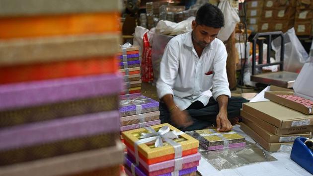 A staff member packs gift boxes of sweets at a factory. “Reduction in corporate gifting is an indicator of economic slowdown and there is no ambiguity on that front,” N. Chandramouli, chief of Mumbai-based TRA Research, told AFP. “All indicators show it is going to be a slow Diwali this year.” (Indranil Mukherjee / AFP)