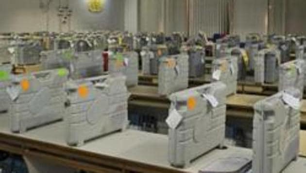 Cases containing electronic voting machines sit in a strong room before the beginning of vote counting at a poll counting center begins. (AP Photo) Cases containing electronic voting machines sit in a strong room before the beginning of vote counting at a poll counting center begins. (AP Photo)
