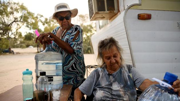 Barkindji elders Patricia (Patsy) Quayle (R) and her daughter Patricia Doyle at their campsite on the dry lakebed of Lake Pamamaroo at Yaama Ngunna Baaka Corroboree Festival. “When you live on a river and you have to have water brought into your town to drink and survive on, what’s that saying? It’s saying that our system ... isn’t looked after properly.” (Tracey Nearmy / REUTERS) Barkindji elders Patricia (Patsy) Quayle (R) and her daughter Patricia Doyle at their campsite on the dry lakebed of Lake Pamamaroo at Yaama Ngunna Baaka Corroboree Festival. “When you live on a river and you have to have water brought into your town to drink and survive on, what’s that saying? It’s saying that our system ... isn’t looked after properly.” (Tracey Nearmy / REUTERS)