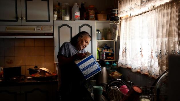Barkindji elder Patricia Doyle uses boxed water to make a cup of tea at her home in Menindee. Despair has turned to anger as residents blame the government for exacerbating the drought by drawing down river water in 2017 for irrigation and uses downstream. Locals now avoid using tap water for drinking and washing babies and children, saying it has caused skin irritation, and prefer boxed and bottled water. (Tracey Nearmy / REUTERS) Barkindji elder Patricia Doyle uses boxed water to make a cup of tea at her home in Menindee. Despair has turned to anger as residents blame the government for exacerbating the drought by drawing down river water in 2017 for irrigation and uses downstream. Locals now avoid using tap water for drinking and washing babies and children, saying it has caused skin irritation, and prefer boxed and bottled water. (Tracey Nearmy / REUTERS)