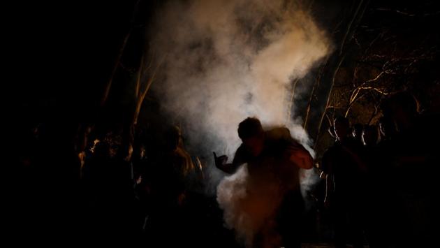 Participants take part in a traditional smoking ceremony as Aboriginal dance groups prepare to perform. “We’re going to start dancing and singing the land,” organiser Bruce Shillingsworth said. “Singing the rivers, singing our environment back again to make it healthy.” (Tracey Nearmy / REUTERS) Participants take part in a traditional smoking ceremony as Aboriginal dance groups prepare to perform. “We’re going to start dancing and singing the land,” organiser Bruce Shillingsworth said. “Singing the rivers, singing our environment back again to make it healthy.” (Tracey Nearmy / REUTERS)