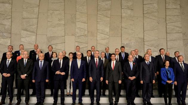 NATO defence ministers and NATO Secretary General Jens Stoltenberg pose for a family photo during the NATO defence ministers meeting at the Alliance headquarters in Brussels.(Reuters Photo) NATO defence ministers and NATO Secretary General Jens Stoltenberg pose for a family photo during the NATO defence ministers meeting at the Alliance headquarters in Brussels.(Reuters Photo)