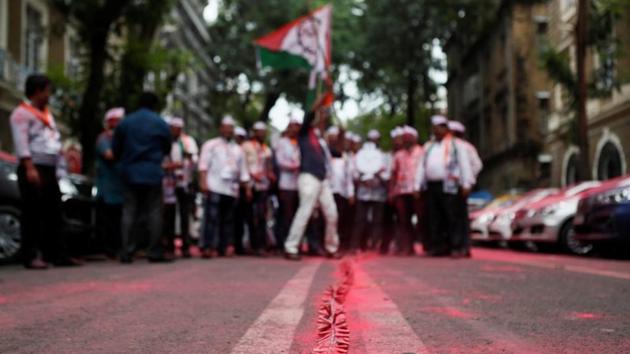 A line of firecrackers is seen outside the Nationalist Congress Party (NCP) office after announcement of initial poll results in Mumbai.(Photo: Reuters) A line of firecrackers is seen outside the Nationalist Congress Party (NCP) office after announcement of initial poll results in Mumbai.(Photo: Reuters)