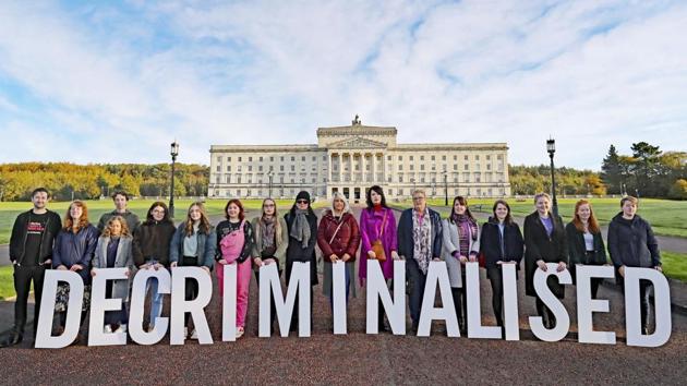 Pro-choice activists take part in a photo call in the grounds of Stormont Parliament, Belfast, Ireland Abortion was decriminalized and same-sex marriage legalized in Northern Ireland, bringing its laws in line with the rest of the UK. (Niall Carson/ PA via AP)