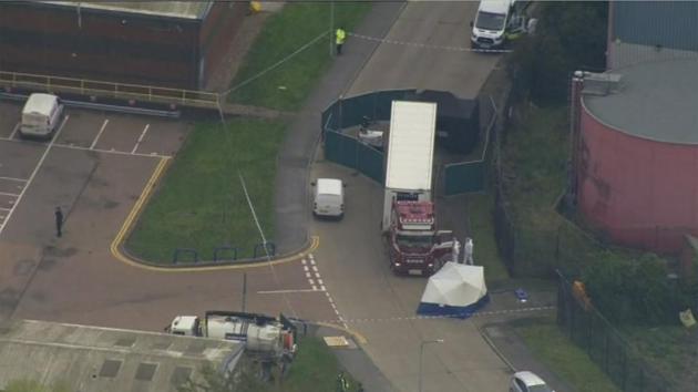 An aerial view as police forensic officers attend the scene after a truck was found to contain a large number of dead bodies, in Thurock, South England. Police said that 39 people were found dead inside a truck container believed to have come from Bulgaria. (UK Pool via AP)