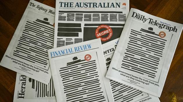 Front pages of major Australian newspapers show a ‘Your right to know’ campaign, in Canberra, Australia. The nation’s biggest newspapers ran front pages on Monday made up to appear heavily redacted to protest against recent legislation that restricts press freedoms, a rare show of unity by the usually tribal media industry. (Lukas Coch / AAP Image via REUTERS)