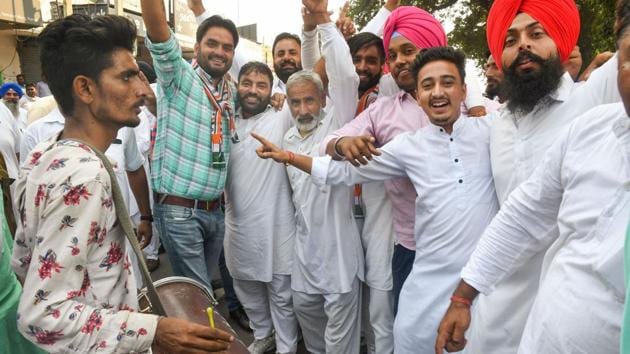 Congress supporters celebrate a party candidate's win in the Assembly election in Karnal on Thursday.(Photo: PTI) Congress supporters celebrate a party candidate's win in the Assembly election in Karnal on Thursday.(Photo: PTI)