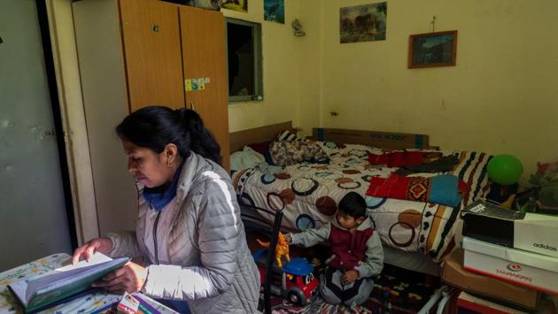 Brigida Simaniz checks the homework of her son Nicolas, 7, in her apartment in the shantytown of Bajo Flores in Buenos Aires. Brigida Simaniz finished her TB treatment earlier this year in May. She works in a textile workshop on 70 pesos ($1.19) an hour and lives with her two children, all three sharing the same bed. Her fear was passing the infection to her kids. (Magali Druscovich / REUTERS) Brigida Simaniz checks the homework of her son Nicolas, 7, in her apartment in the shantytown of Bajo Flores in Buenos Aires. Brigida Simaniz finished her TB treatment earlier this year in May. She works in a textile workshop on 70 pesos ($1.19) an hour and lives with her two children, all three sharing the same bed. Her fear was passing the infection to her kids. (Magali Druscovich / REUTERS)