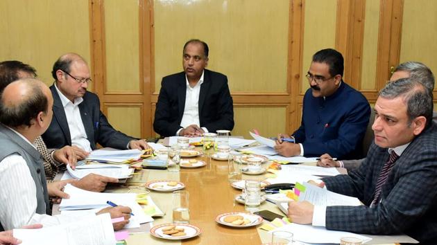 Chief minister Jai Ram Thakur along with officials during the meeting of State Single Window Clearance & Monitoring Authority in Shimla on Friday.(HT photo)