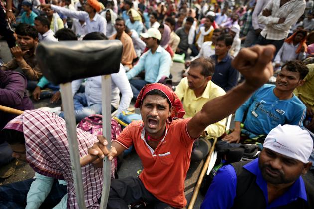 Differently-abled railway applicants raise slogans during a protest against Railway Ministry, at Mandi House circle, in New Delhi, on Thursday, October 24, 2019. (Biplov Bhuyan/HT PHOTO) Differently-abled railway applicants raise slogans during a protest against Railway Ministry, at Mandi House circle, in New Delhi, on Thursday, October 24, 2019. (Biplov Bhuyan/HT PHOTO)