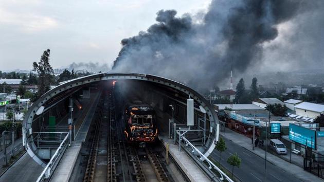 Aerial view of a burnt metro station after protests in Santiago, Chile. Chilean President Sebastian Pinera announced the suspension of the increase in the price of metro tickets which had triggered violent protests. (Javier Torres / AFP)