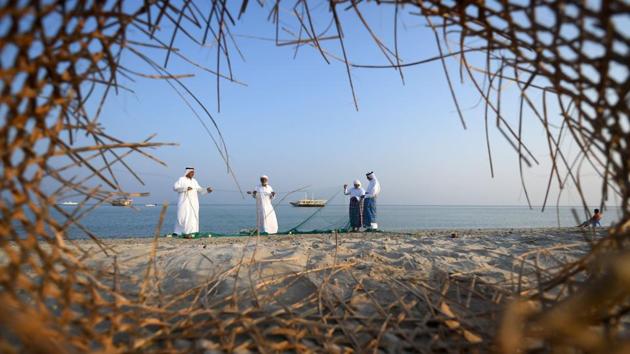 Emirati fishermen set up nets on the shore during the Dalma Sailing Festival, off the coast of Dalma island in the Persian Gulf, about 40 kilometres off of the Emirati capital Abu Dhabi, United Arab Emirates. (Karim sahib / AFP)