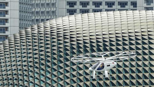 A prototype of Volocopter air taxi in flight during test flight over Marina Bay in Singapore. (Ore Huiying / Getty Images)
