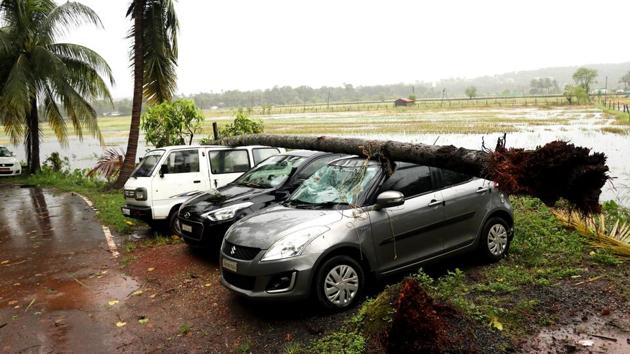 Vehicles trapped under a tree due to Cyclone 'Kyarr' activity in Goa on Friday. The India Meteorological Department (IMD) issued ‘yellow alert’ for Saturday and predicted heavy rainfall over north and south Goa districts. The IMD further stated, squally wind speed reaching 55-65 kmph gusting to 75 kmph is likely to prevail along and off Ratnagiri, Sindhudurg, Raigad districts of Maharashtra and Goa during next 12 hours. (Atish Naik / ANI)