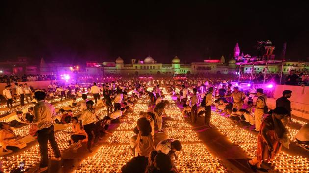 Devotees light earthen lamps on the bank of Saryu River during Deepotsav celebrations in Ayodhya, which created a record for the most number of lamps lit in the Guinness Book of World Records. (PTI) Devotees light earthen lamps on the bank of Saryu River during Deepotsav celebrations in Ayodhya, which created a record for the most number of lamps lit in the Guinness Book of World Records. (PTI)