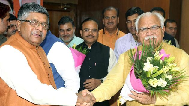 Haryana Chief Minister Manohar Lal Khattar being congratulated by Union Minister Ravi Shankar Prasad, after he has been elected BJP's legislative party leader, in Chandigarh on Saturday. (ANI Photo) Haryana Chief Minister Manohar Lal Khattar being congratulated by Union Minister Ravi Shankar Prasad, after he has been elected BJP's legislative party leader, in Chandigarh on Saturday. (ANI Photo)