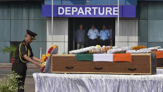 Vice Chief of Army Staff Lieutenant General Manoj Mukund Naravane pays his respects to the mortal remains of two soldiers, Hawaldar Padam Bahadur Shrestha (Assam) and Rifleman Gamil Kumar Shrestha, who were killed in cross-border shelling in Jammu and Kashmir, at Palam Technical Airport, in New Delhi. (Vipin Kumar / HT Photo) Vice Chief of Army Staff Lieutenant General Manoj Mukund Naravane pays his respects to the mortal remains of two soldiers, Hawaldar Padam Bahadur Shrestha (Assam) and Rifleman Gamil Kumar Shrestha, who were killed in cross-border shelling in Jammu and Kashmir, at Palam Technical Airport, in New Delhi. (Vipin Kumar / HT Photo)