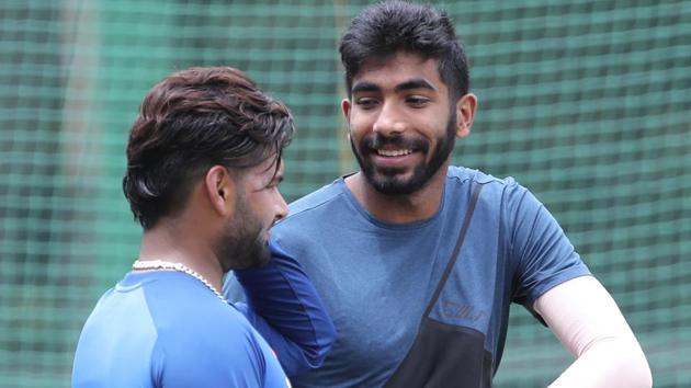 Jasprit Bumrah, right, shares a light moment with fellow cricketer Rishabh Pant.(AP)